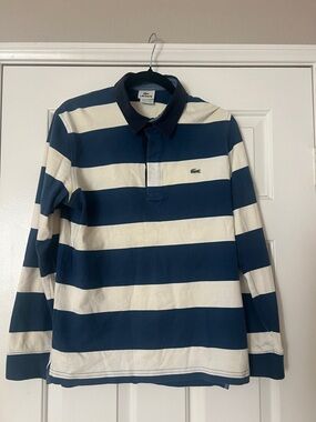 Lacoste long sleeve rugby shirt size small. Traditional blue /off white colors.